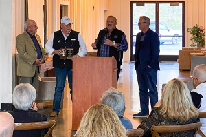 Wes Kryger receives award.
