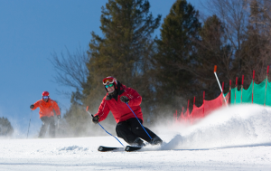 Fast skier carving down the hill.
