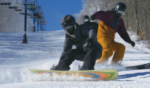 Snowboarders shredding it.